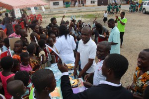 Happy students with new school supplies and dental care.