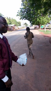 Dr-Ankamah-Feeding-a-homeless-mentally-chalenged- gentlemanGhana-Missions-2016IMG 2390     