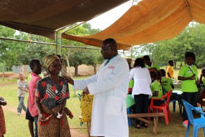 Dr.Ankamah-and-his team-giving-medical-advice-to-a-senior-citizenIMG 0070 (2)     